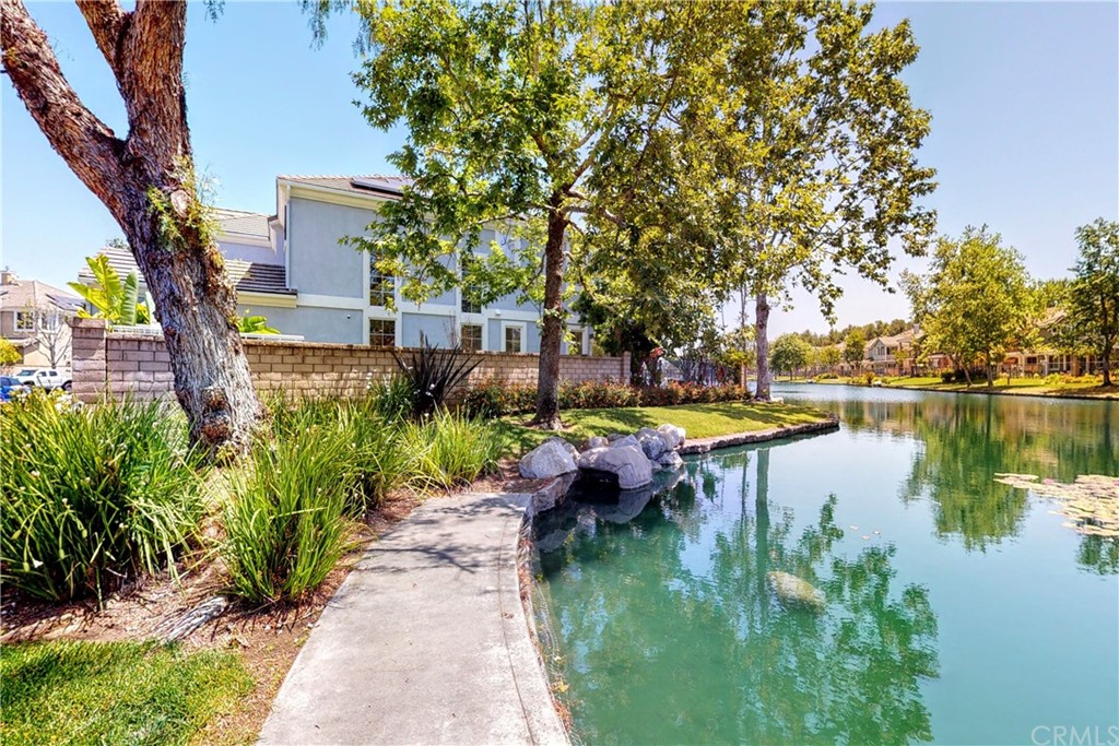 50 Lakeside Drive Buena Park, CA 90621 - Photo 5 of 69 a view of swimming pool with table and chairs under an umbrella