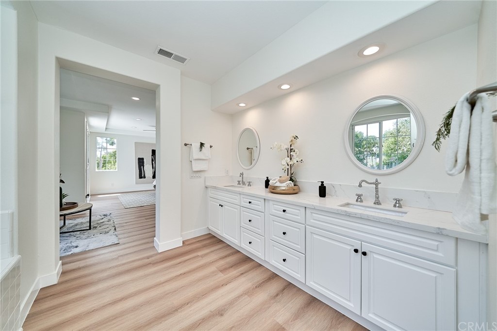 50 Lakeside Drive Buena Park, CA 90621 - Photo 54 of 69 a spacious bathroom with a double vanity sink and a mirror