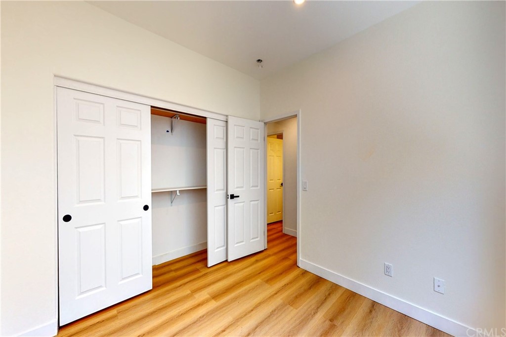 50 Lakeside Drive Buena Park, CA 90621 - Photo 58 of 69 a view of an empty room with wooden floor