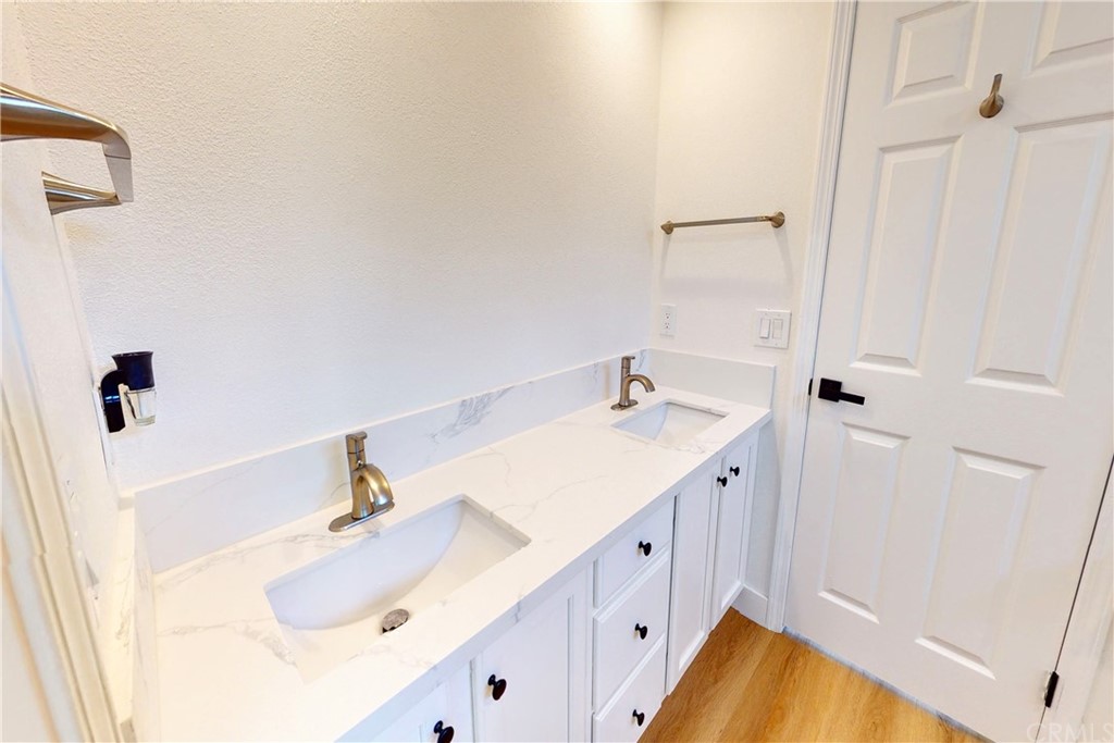 50 Lakeside Drive Buena Park, CA 90621 - Photo 59 of 69 a bathroom with a sink and a mirror