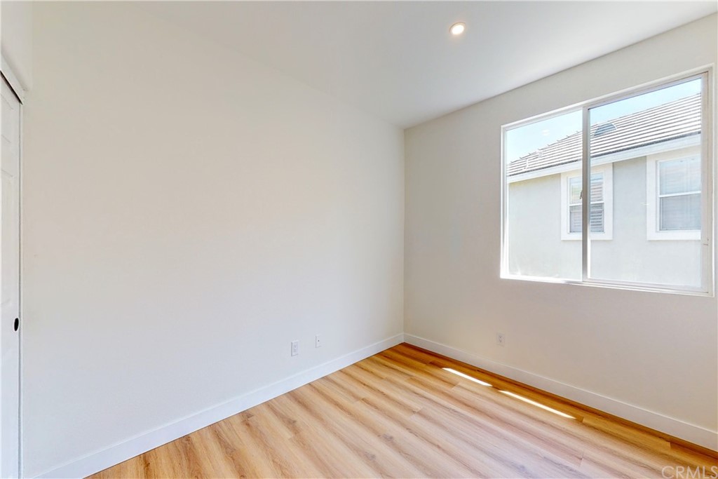 50 Lakeside Drive Buena Park, CA 90621 - Photo 61 of 69 a view of an empty room with wooden floor and a window