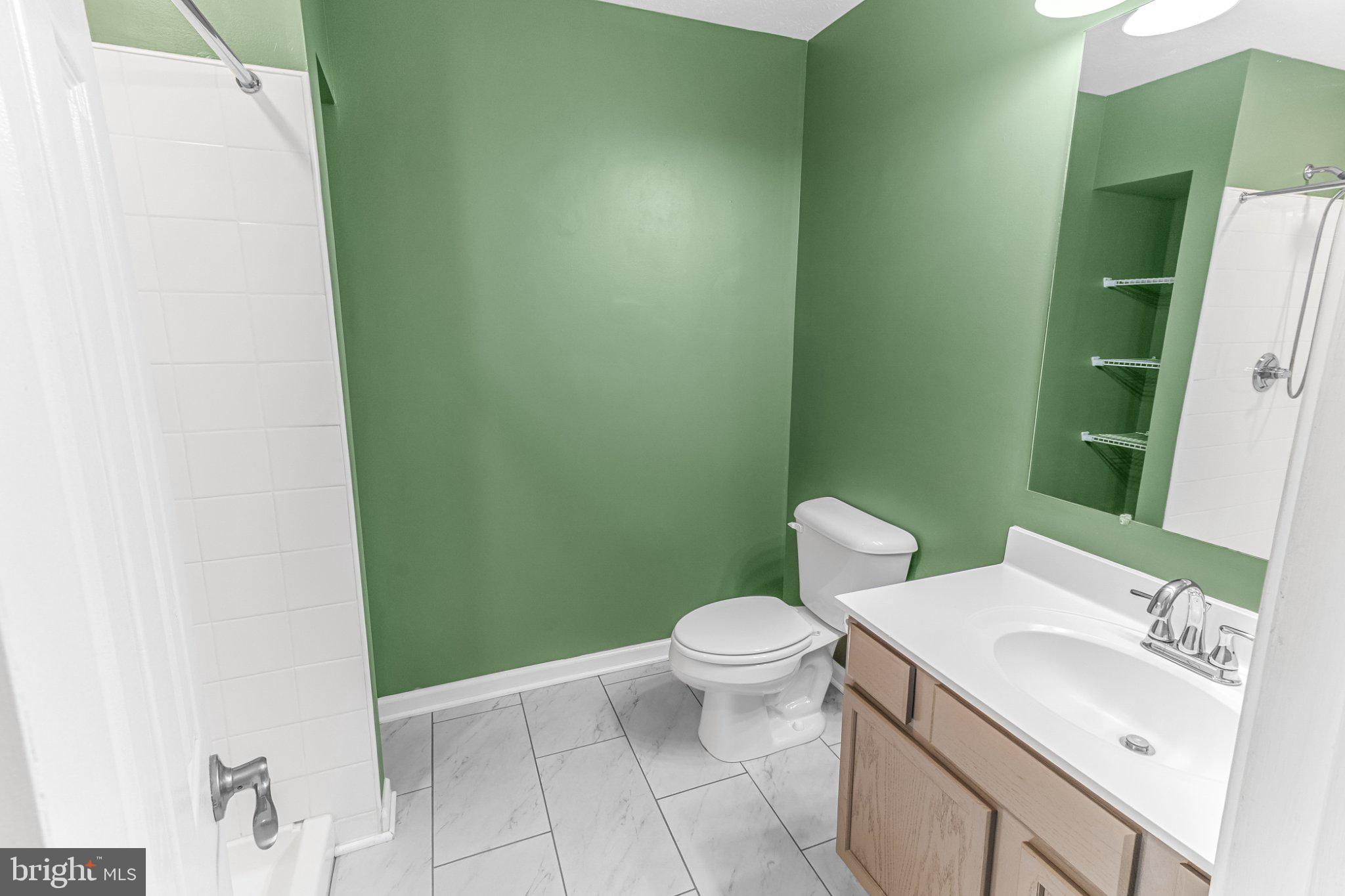 2471 Sulphur Springs Road Inwood, WV 25428 - Photo 10 of 44 Fresh and vibrant green bathroom oasis.