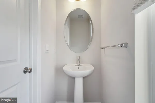 a bathroom with a sink a mirror and a shower