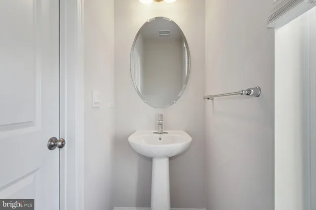 a bathroom with a sink a mirror and a shower