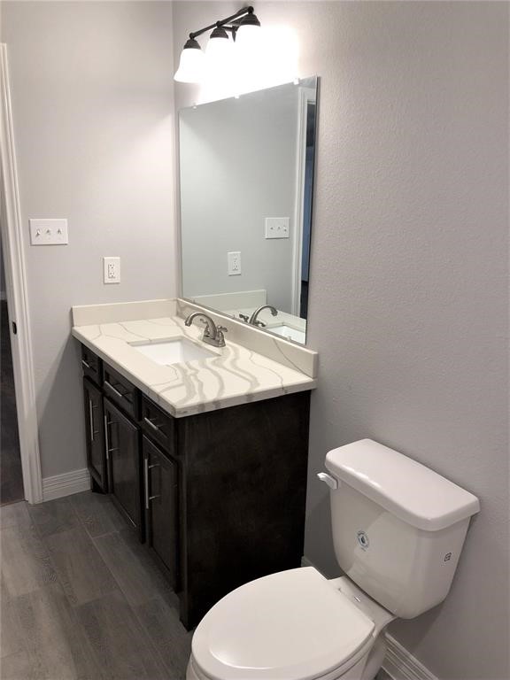 6207 Conley Street Houston, TX 77021 - Photo 9 of 9 a bathroom with a granite countertop toilet sink and mirror