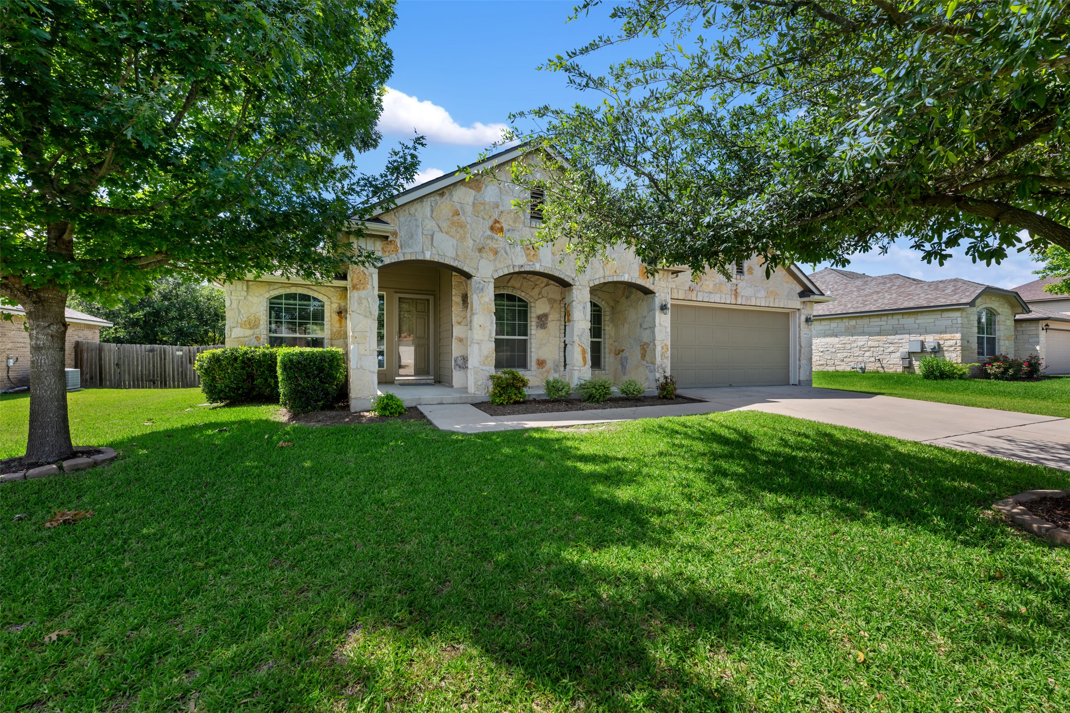18820 Edinburgh Castle Road Pflugerville, TX 78660 - Photo 1 of 37 a front view of a house with a garden and yard