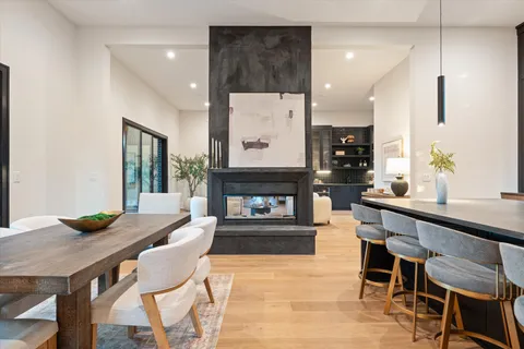 a kitchen with stainless steel appliances kitchen island granite countertop a stove and a sink