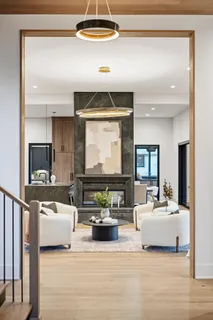 a dining room with chairs and wooden floor