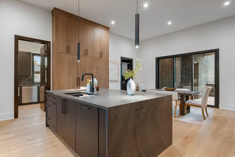 a kitchen with stainless steel appliances granite countertop a sink and a cabinets