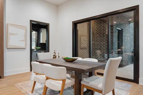 a bathroom with a granite countertop sink toilet and a mirror