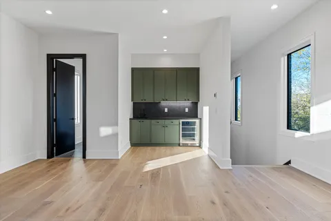 a bathroom with a tub sink and mirror