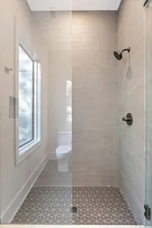 a bathroom with a sink toilet and a mirror