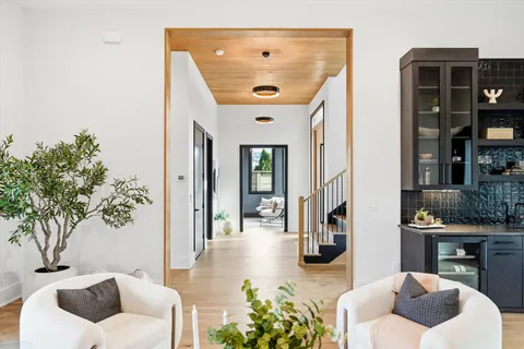 a living room with furniture a fireplace and decor