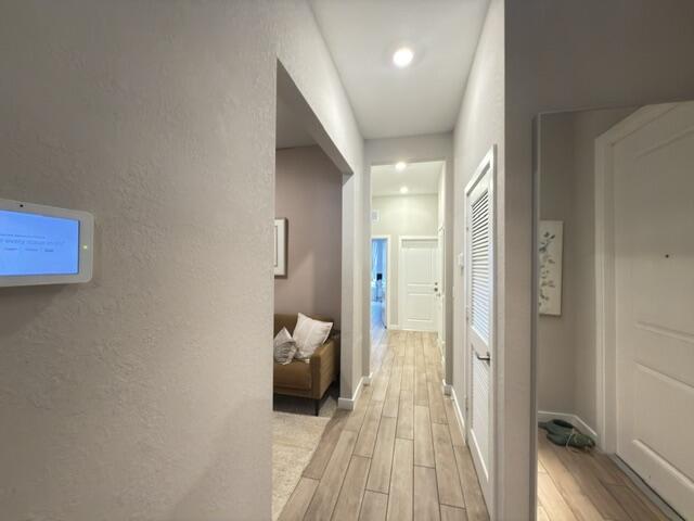 19696 Weathervane Way Loxahatchee, FL 33470 - Photo 2 of 39 a view of a bedroom with a bed and wooden floor