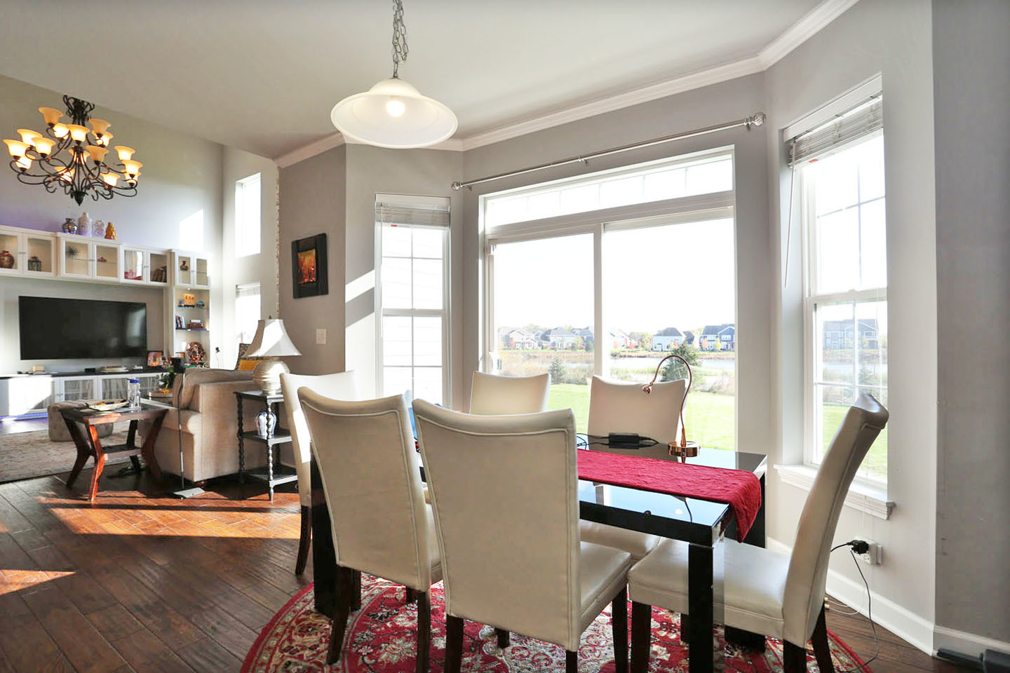 3441 Harold Circle Hoffman Estates, IL 60192 - Photo 11 of 34 a living room with furniture a flat screen tv and a large window