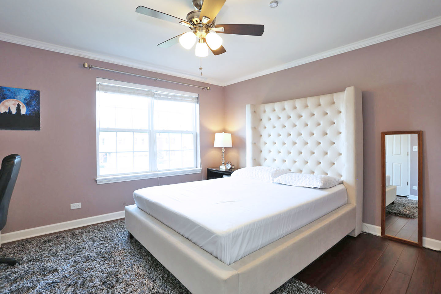 3441 Harold Circle Hoffman Estates, IL 60192 - Photo 27 of 34 a bedroom with a large bed and a chandelier
