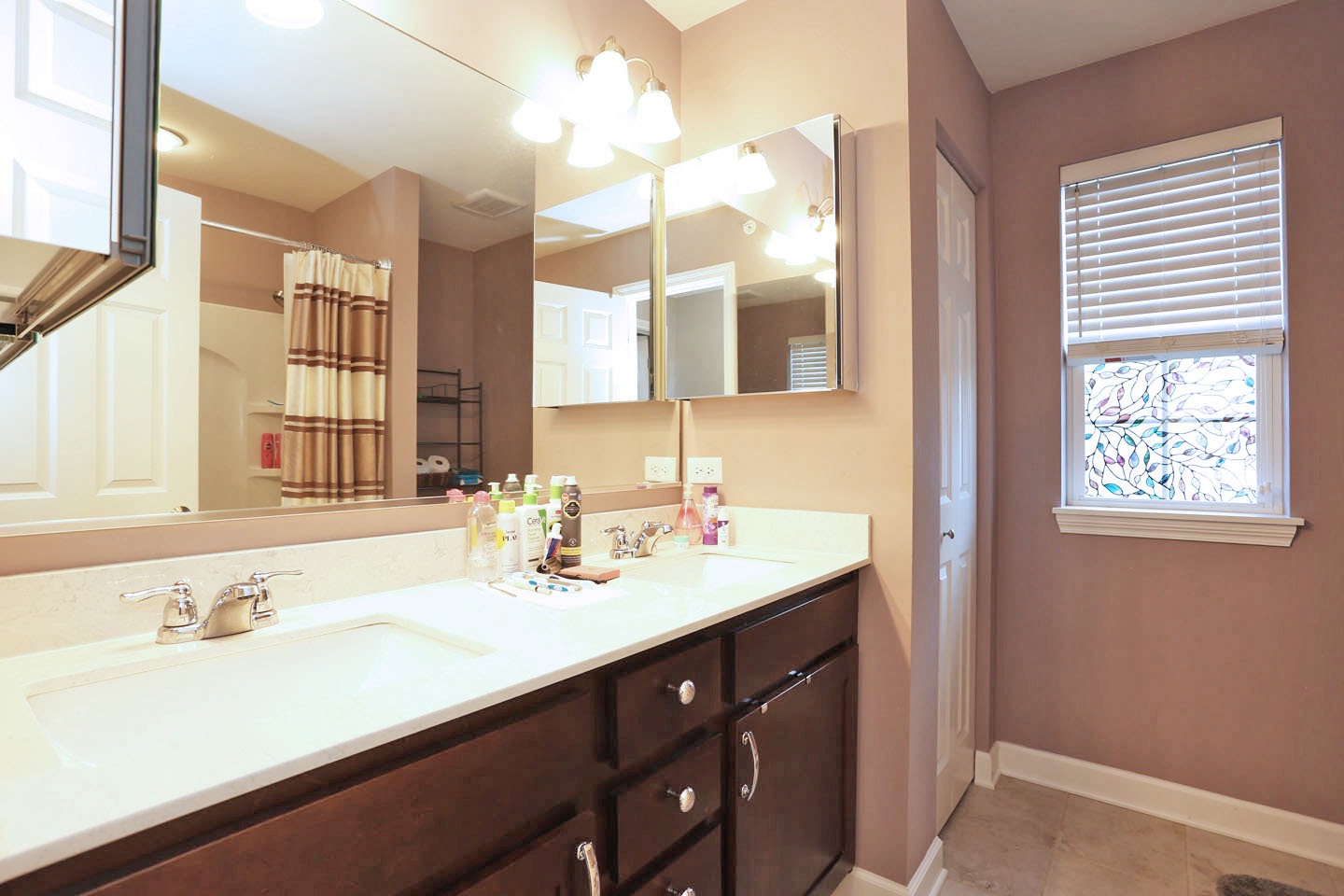 3441 Harold Circle Hoffman Estates, IL 60192 - Photo 29 of 34 a bathroom with a sink double vanity and a mirror