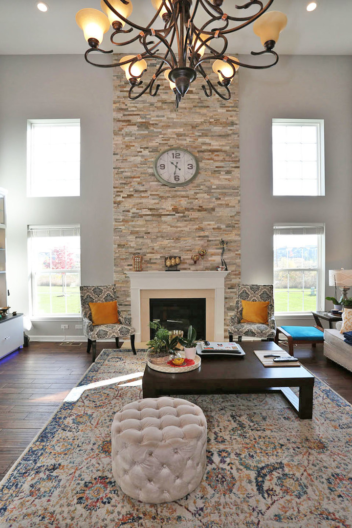 3441 Harold Circle Hoffman Estates, IL 60192 - Photo 3 of 34 a living room with furniture and a fireplace