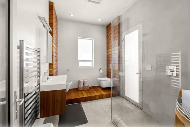 a spacious bedroom with a bed and a couch