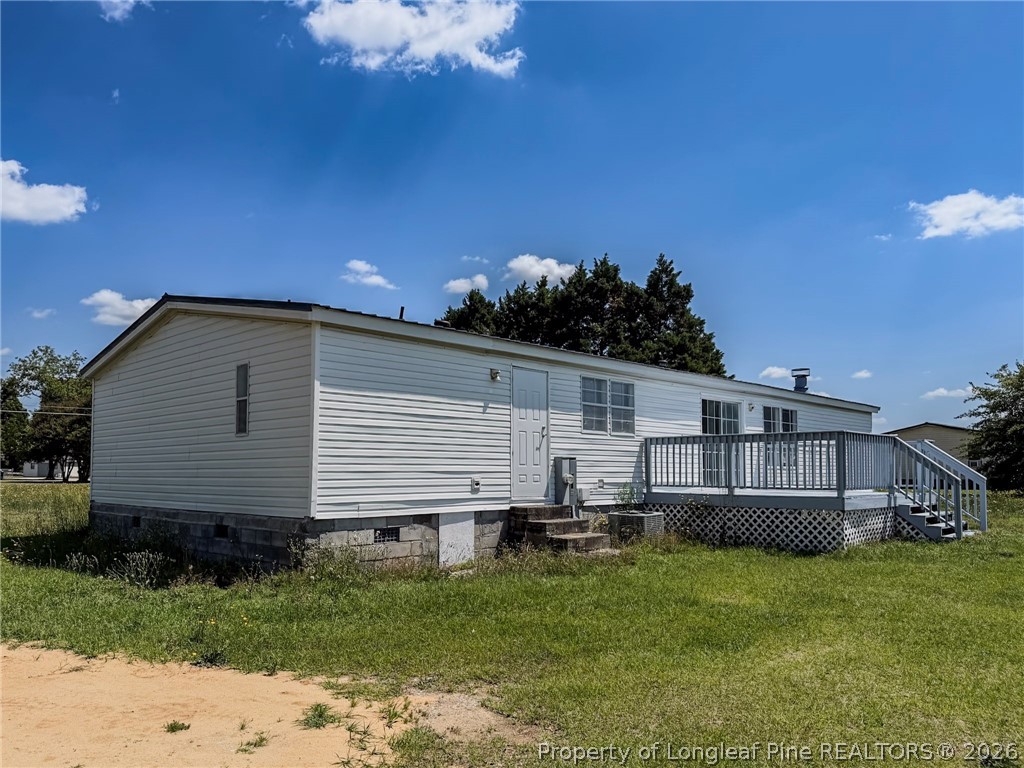 898 Brisson Road St. Pauls, NC 28384 - Photo 5 of 18 a view of a house with a backyard