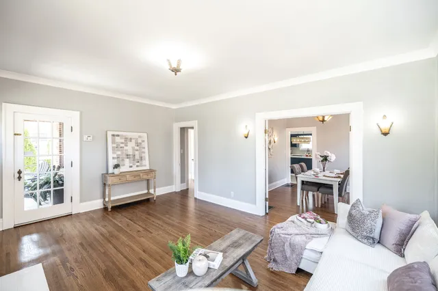 a dining room with furniture and window