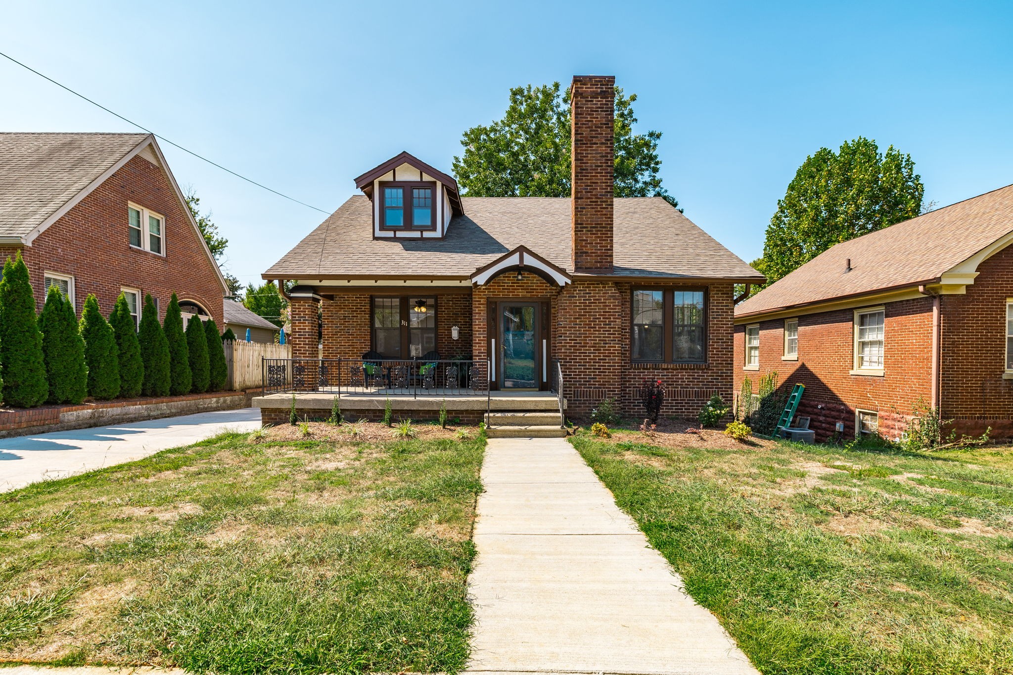 311 North Walnut Street Springfield, TN 37172 - Photo 2 of 79 a view of a house with floor to ceiling windows and a yard