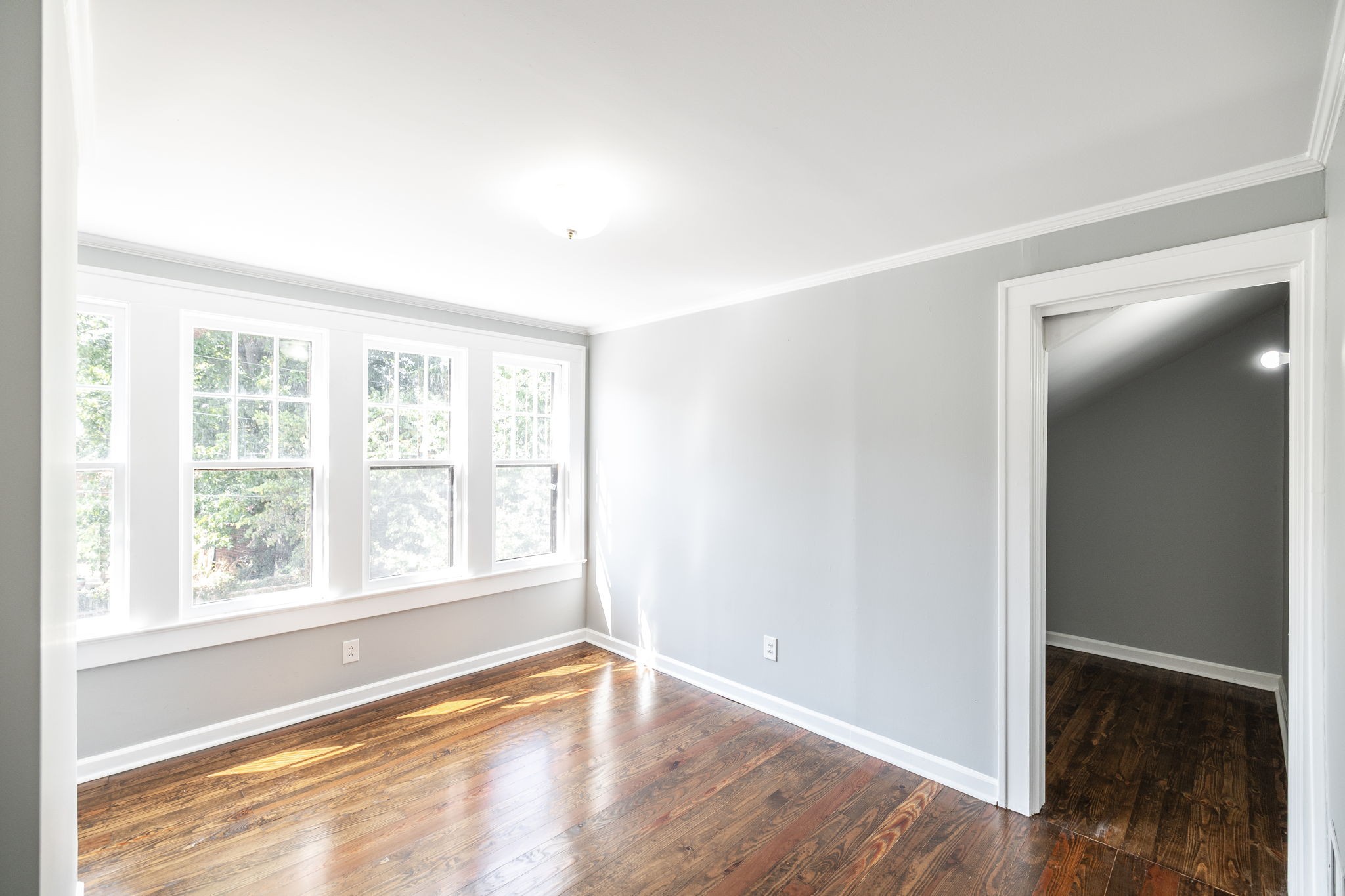 311 North Walnut Street Springfield, TN 37172 - Photo 42 of 79 an empty room with wooden floor and windows