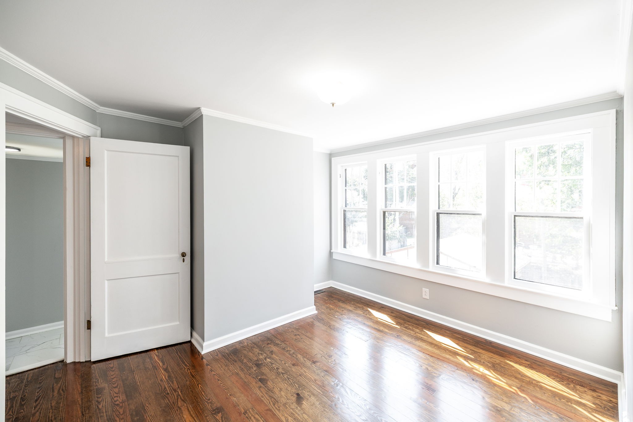 311 North Walnut Street Springfield, TN 37172 - Photo 43 of 79 an empty room with wooden floor and windows