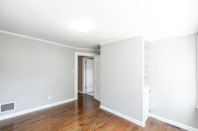 a view of room with window and hardwood floor