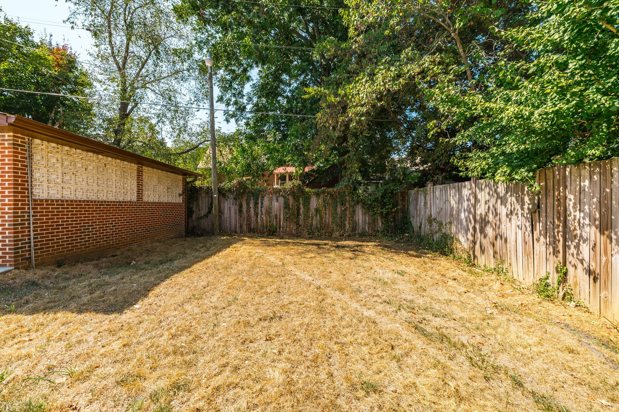 311 North Walnut Street Springfield, TN 37172 - Photo 68 of 79 a view of backyard with wooden fence and large trees