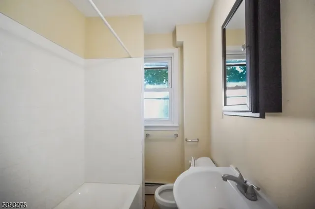 a bathroom with a toilet and sink