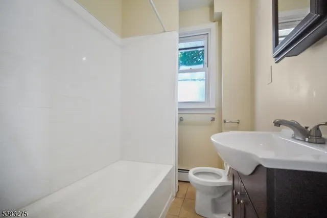 a bathroom with a sink toilet and a bathtub