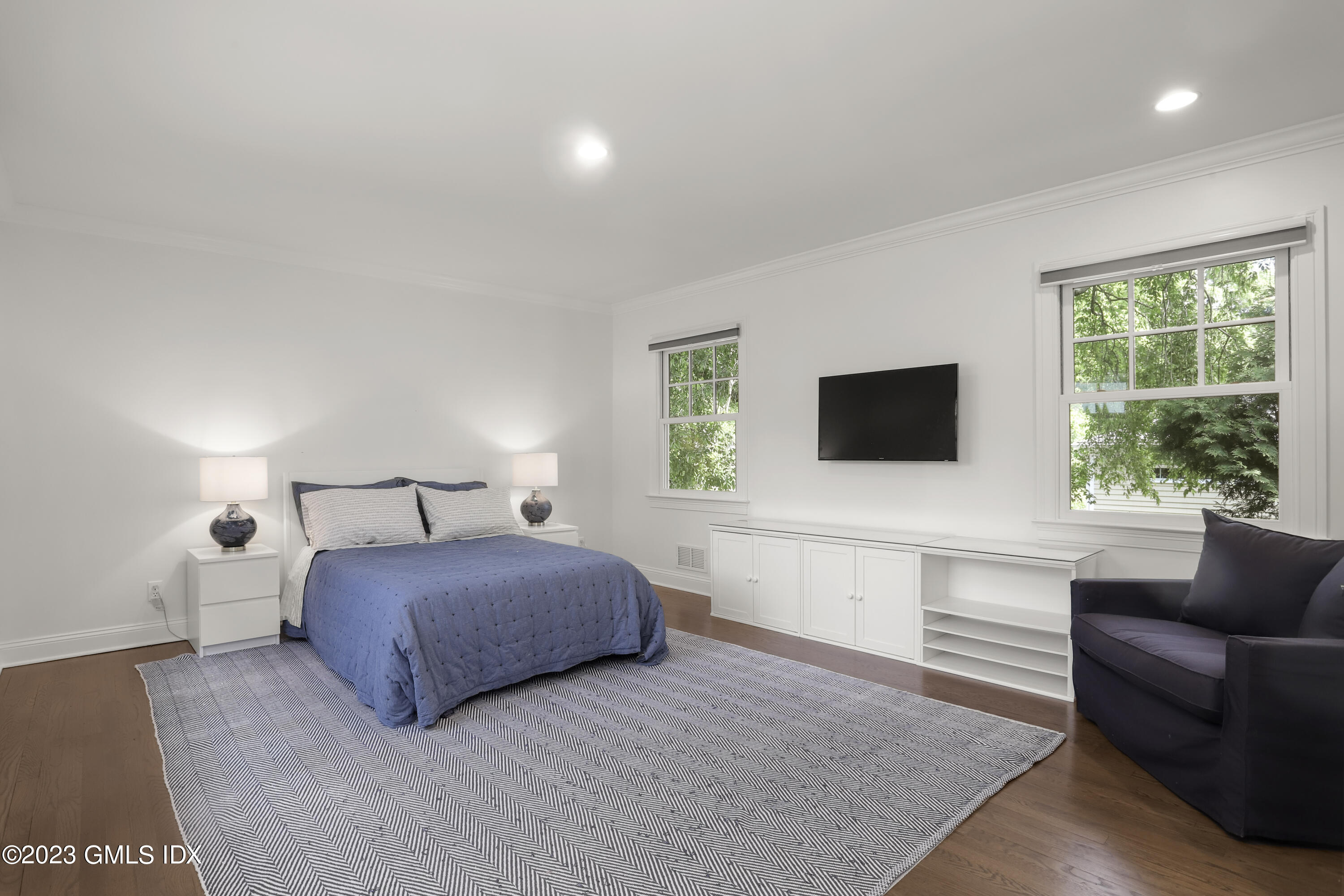 85 Mallard Drive Greenwich, CT 06830 - Photo 18 of 45 a bedroom with a bed and a couch