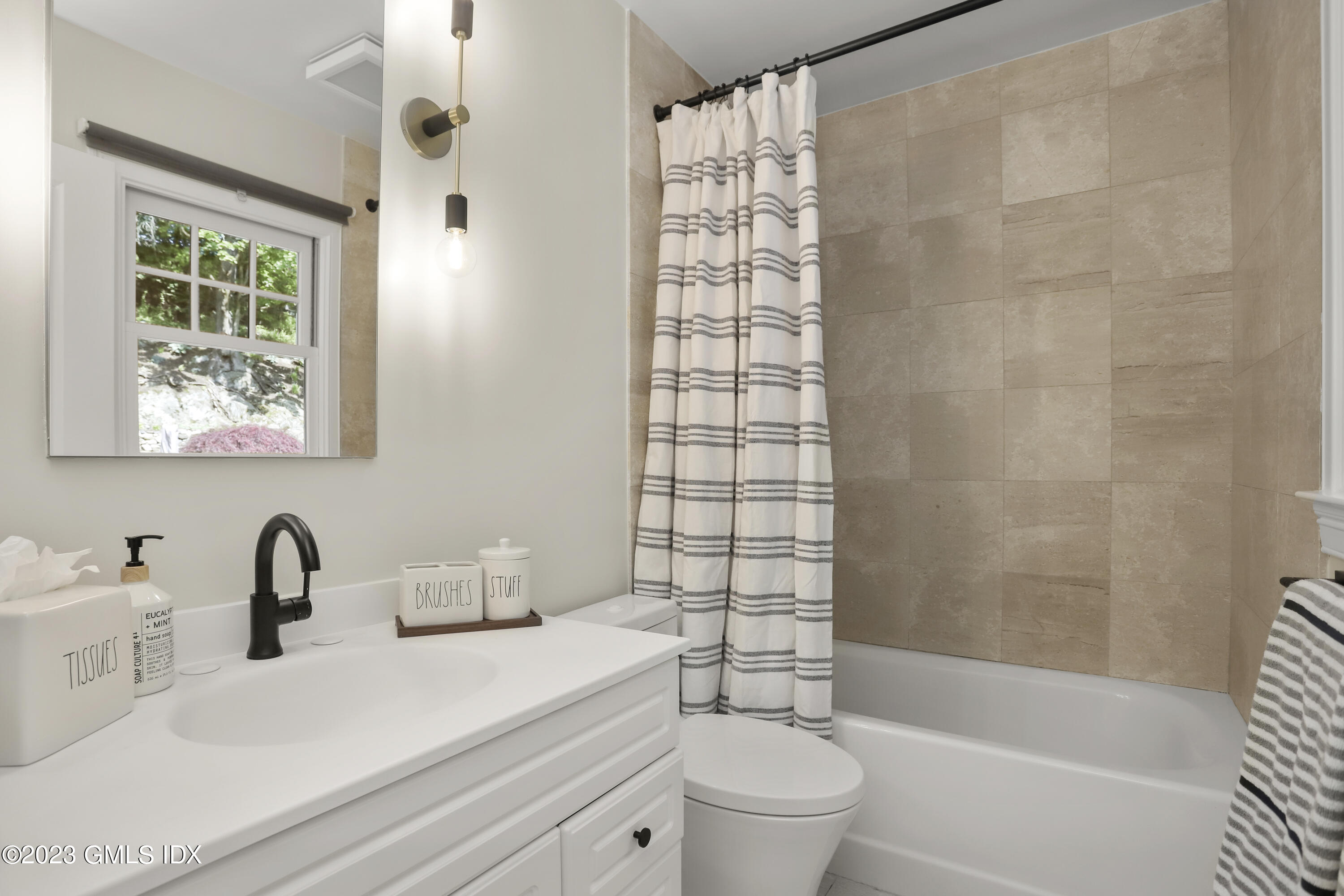 85 Mallard Drive Greenwich, CT 06830 - Photo 19 of 45 a bathroom with a sink a toilet and shower