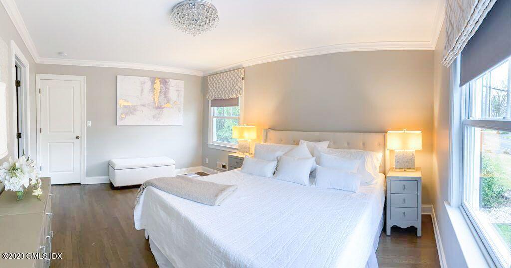 85 Mallard Drive Greenwich, CT 06830 - Photo 23 of 45 a bedroom with a bed and wooden floor