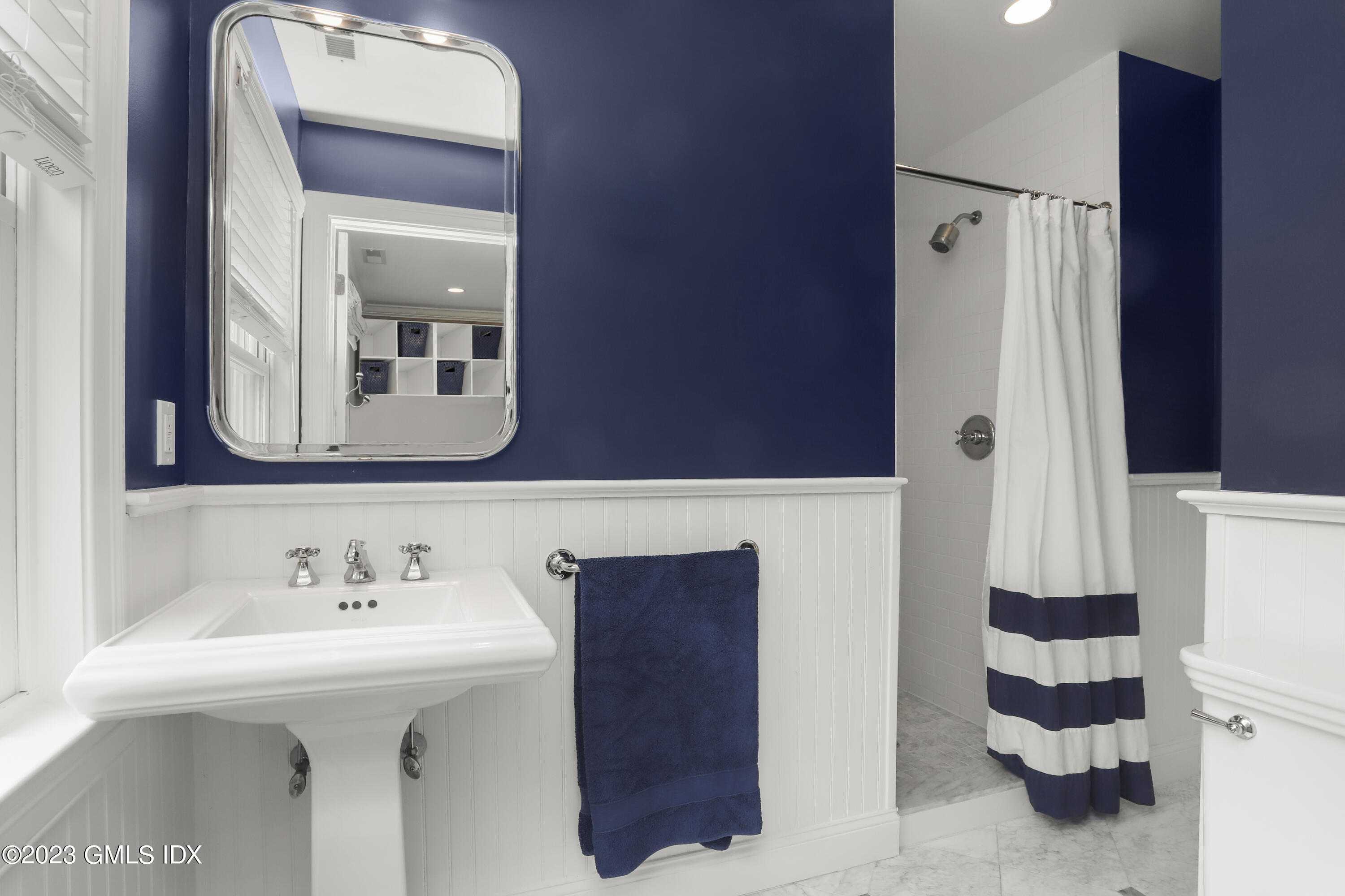 85 Mallard Drive Greenwich, CT 06830 - Photo 29 of 45 a bathroom with a sink and a mirror