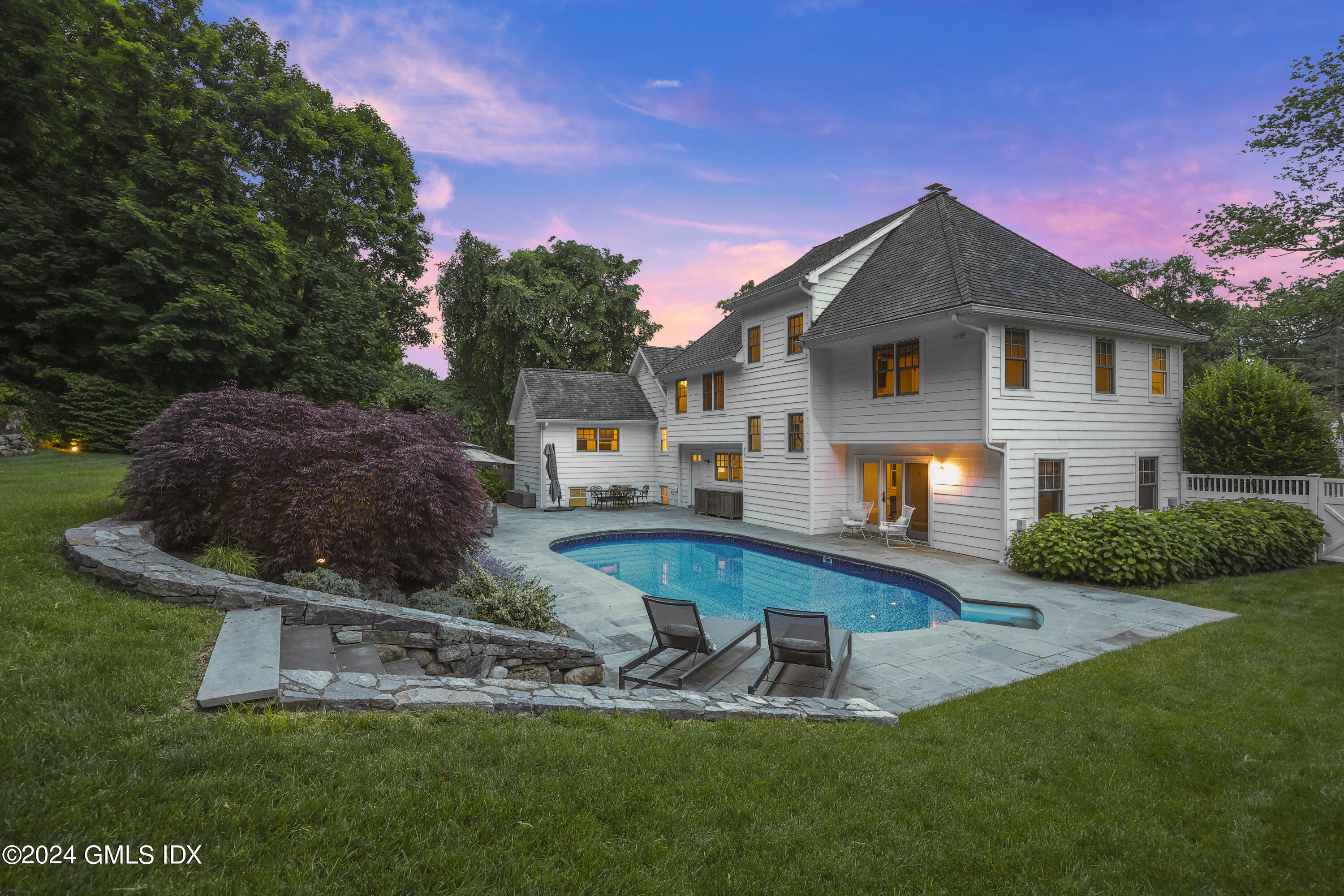 85 Mallard Drive Greenwich, CT 06830 - Photo 40 of 45 a view of a house with a yard porch and sitting area