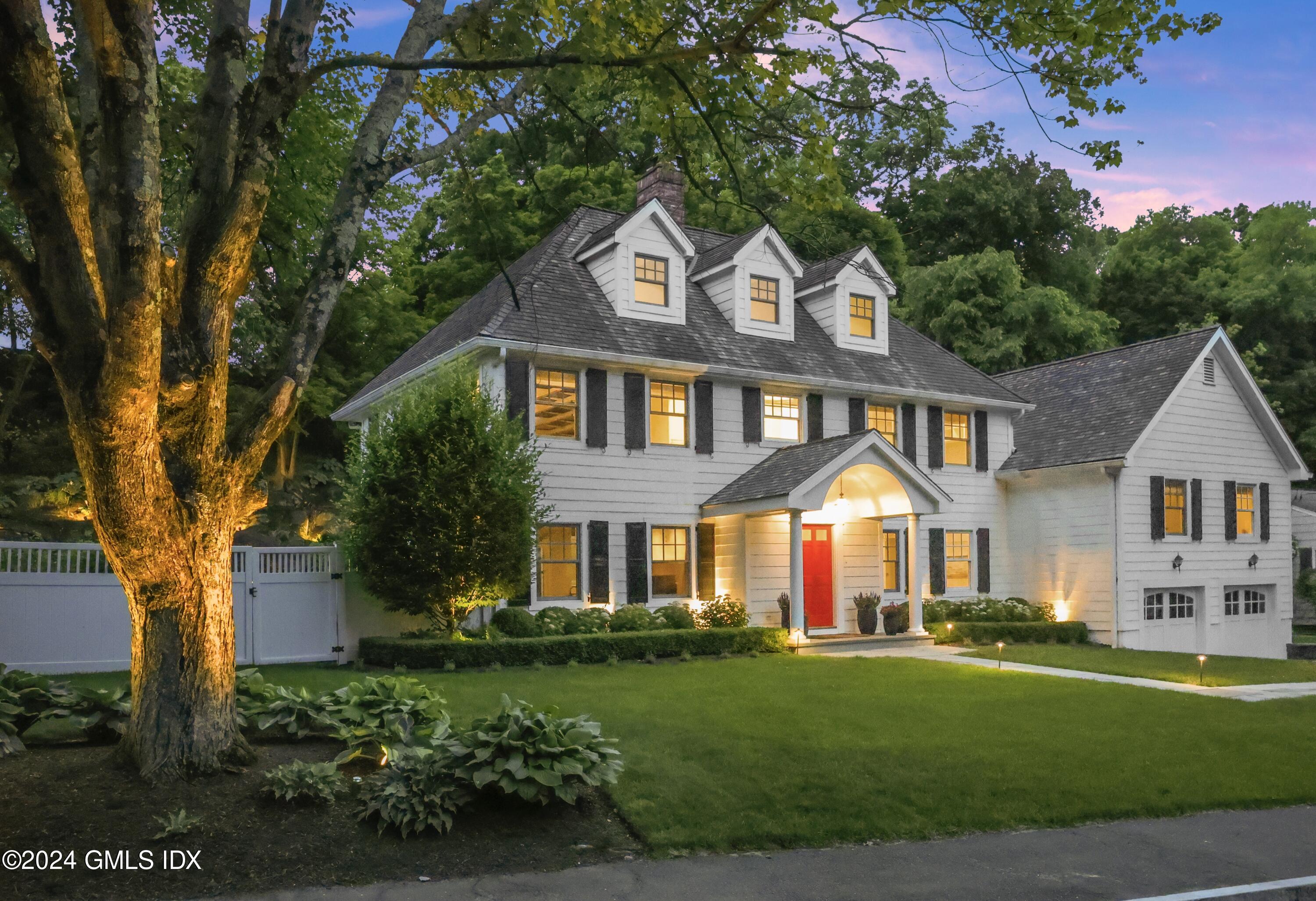 85 Mallard Drive Greenwich, CT 06830 - Photo 41 of 45 a front view of a house with a yard