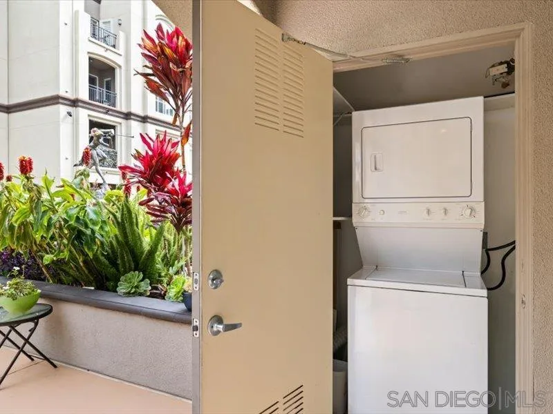 9237 Regents Road, Unit K101 La Jolla, CA 92037 - Photo 15 of 29 a utility room with dryer and washer
