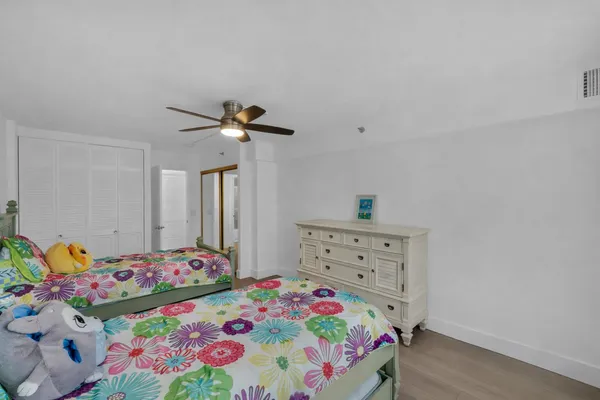 a bedroom with a bed and a dresser