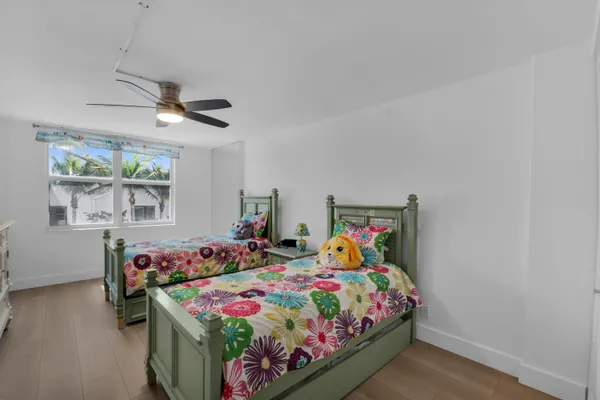 a bedroom with bed and window
