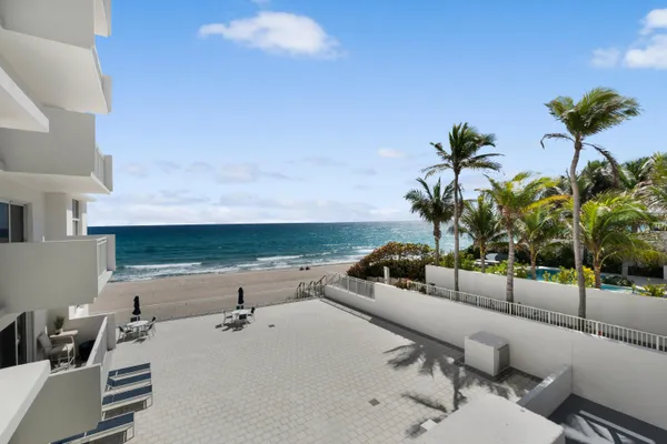 a view of a swimming pool and a patio