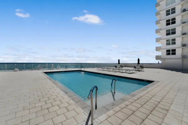 a kitchen with a sink cabinets and appliances