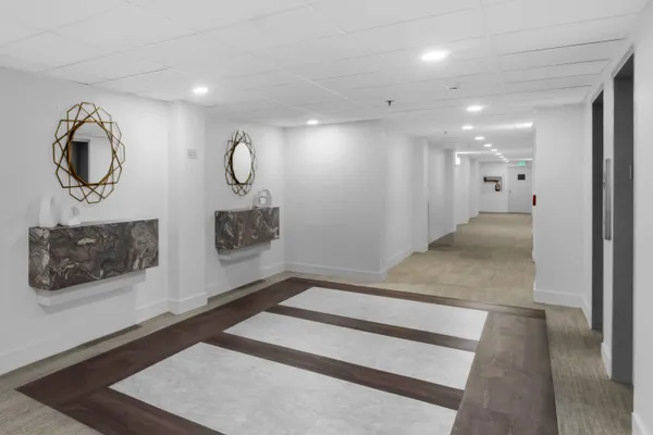 a view of room with window and wooden floor