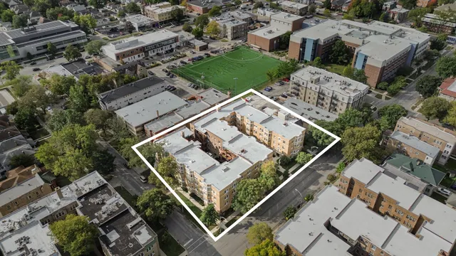 an aerial view of multiple houses with yard
