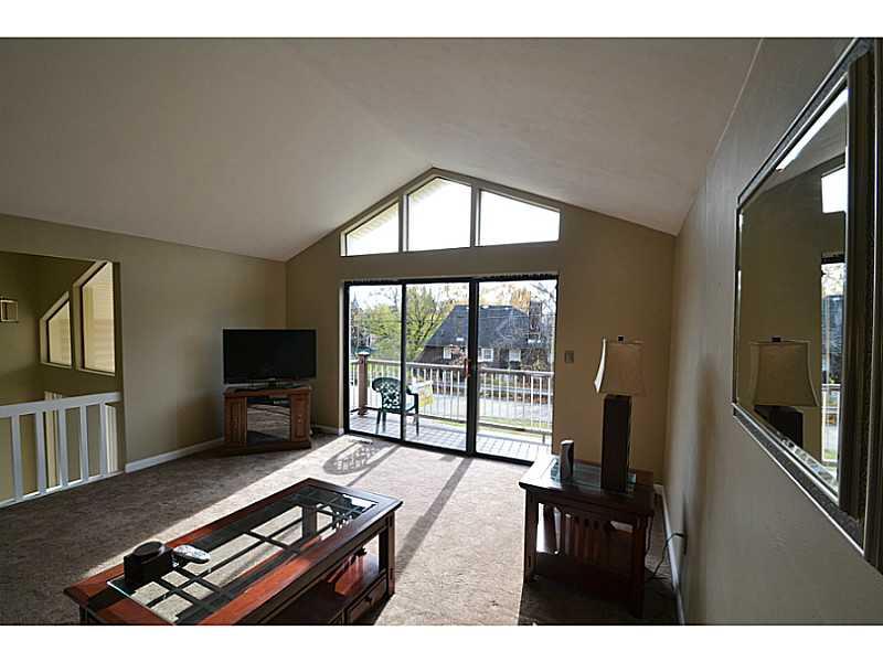 68 Maplewood Road Pittsburgh, PA 15209 - Photo 4 of 24 Living Room. Windows abound with natural light. Front balcony, cathedral ceilings.