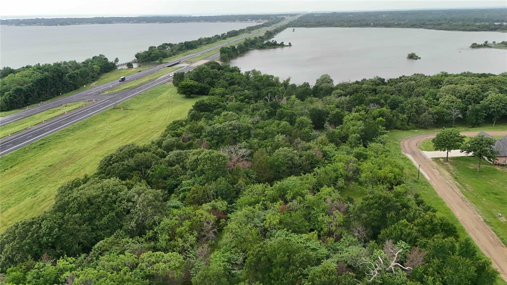102 Lakeview Trail Mabank, TX 75147 - Photo 3 of 6 a view of a lake with a mountain view