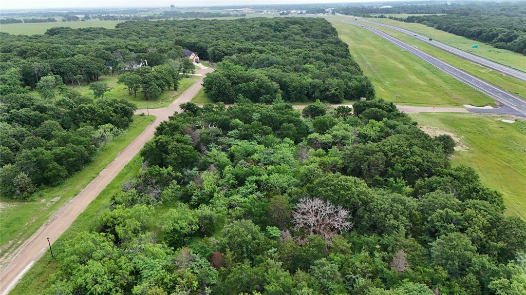 102 Lakeview Trail Mabank, TX 75147 - Photo 4 of 6 a view of a green field with lots of trees