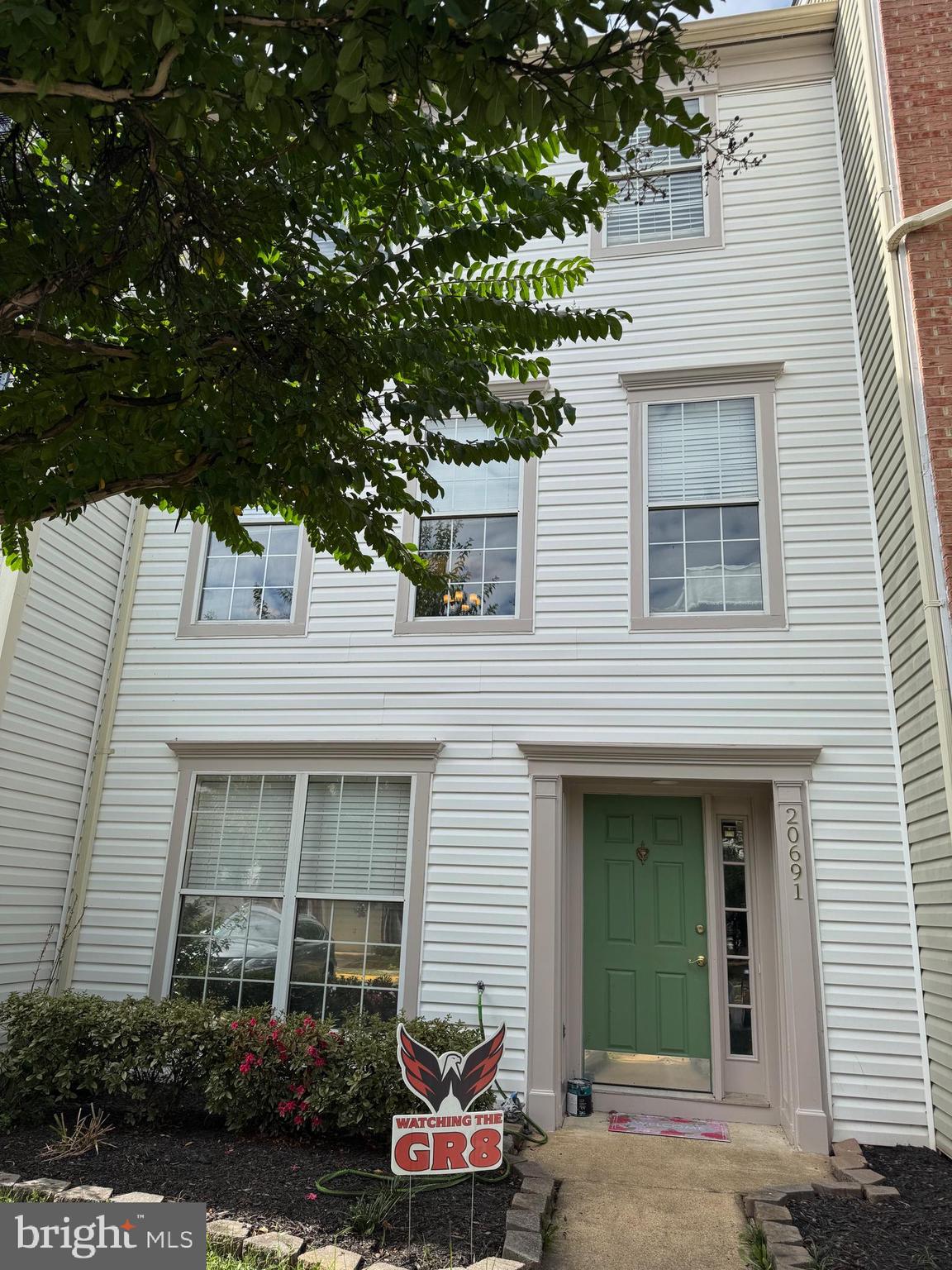 20691 Southwind Terrace Ashburn, VA 20147 - Photo 1 of 16 a front view of a house