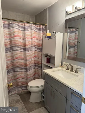 a bedroom with bed and a window